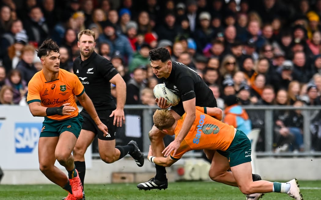 Shaun Stevenson of the All Blacks is tackled by Tate McDermott of Australia during the All Black Vs Australia match at Forsyth Barr Stadium, Dunedin, New Zealand, on 5 August 2023.