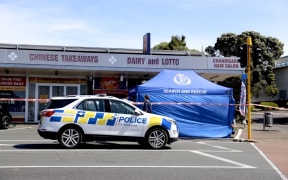 A police tent outside a dairy in New Windsor where two people were assaulted on 5 October, 2023.