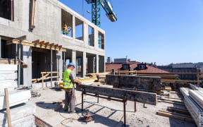 workers with power tools on the building site