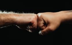 Two hands fist bump.