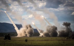 Missiles are launched from a United States military HIMARS system during military drills at a firing range at Shoalwater Bay in Queensland, Australia, as part of Exercise Talisman Sabre. The two-week joint military exercise involves thousands of personnel from New Zealand, Australia, the United States and ten other countries.