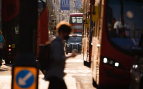 Buses and taxis wait at traffic lights on Oxford Street in London, England, on September 16, 2020. While the UK continues to edge towards economic recovery some 3,991 new coronavirus cases were recorded today, in what is the highest daily figure in the country since May 8.