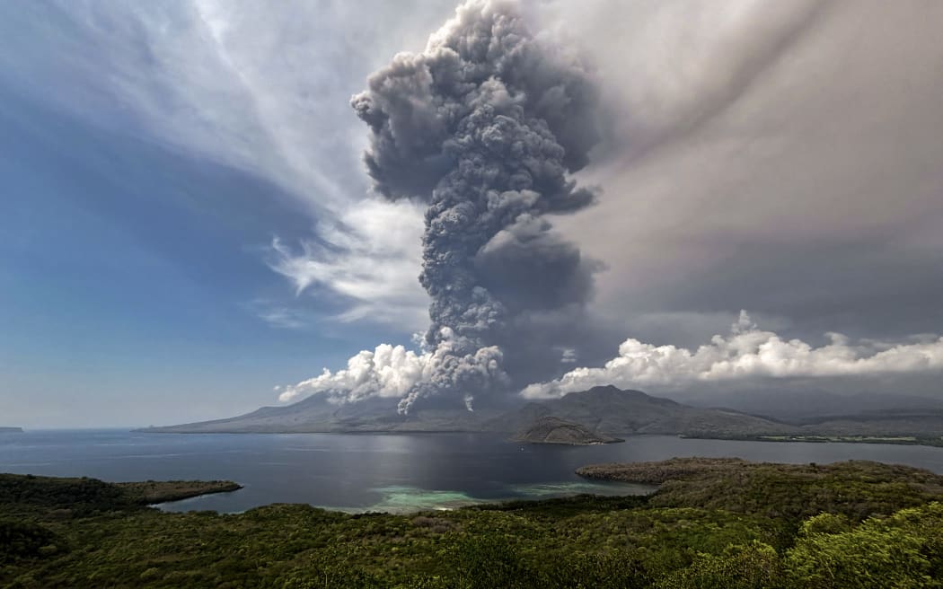 This aerial handout picture taken on November 9, 2024 and released on November 10, 2024 by the National Disaster Mitigation Agency shows the eruption of Mount Lewotobi Laki Laki as seen from the Eputobi rest area in East Flores, East Nusa Tenggara. (Photo by Handout / National Disaster Mitigation Agency / AFP) / RESTRICTED TO EDITORIAL USE - MANDATORY CREDIT AFP PHOTO / NATIONAL DISASTER MITIGATION AGENCY - NO MARKETING - NO ADVERTISING CAMPAIGNS - DISTRIBUTED AS A SERVICE TO CLIENTS