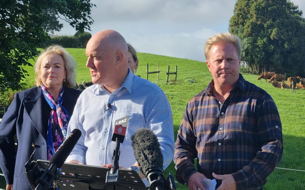 National Party leader Christopher Luxon, centre, with MPs Judith Collins and Todd McClay, announces the party's new farming package, 19 April 2023.