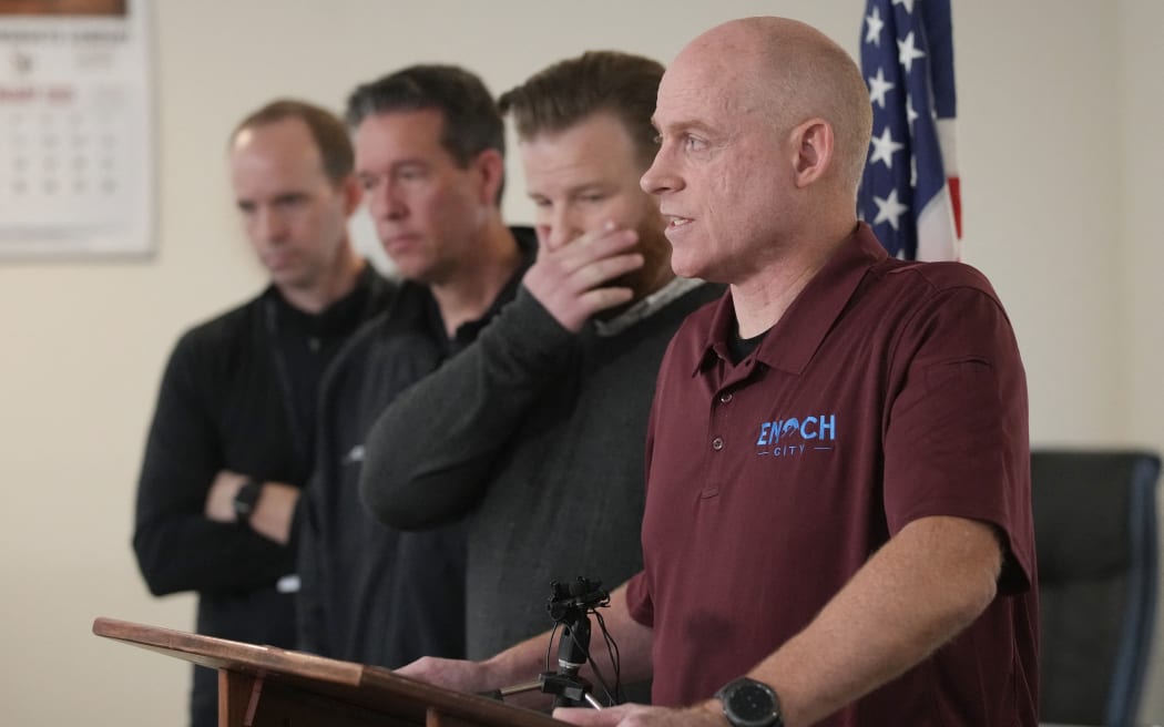 Rob Dotson (right), Enoch City manager holds a news conference at city hall along with Geoffrey Chesnut, Enoch Mayor, Jackson Ames, Enoch Chief of Police and Tim Marriott (left), Iron County School District Counsellor, on the murder of eight people in the same family on January 5, 2023 in Enoch, Utah.