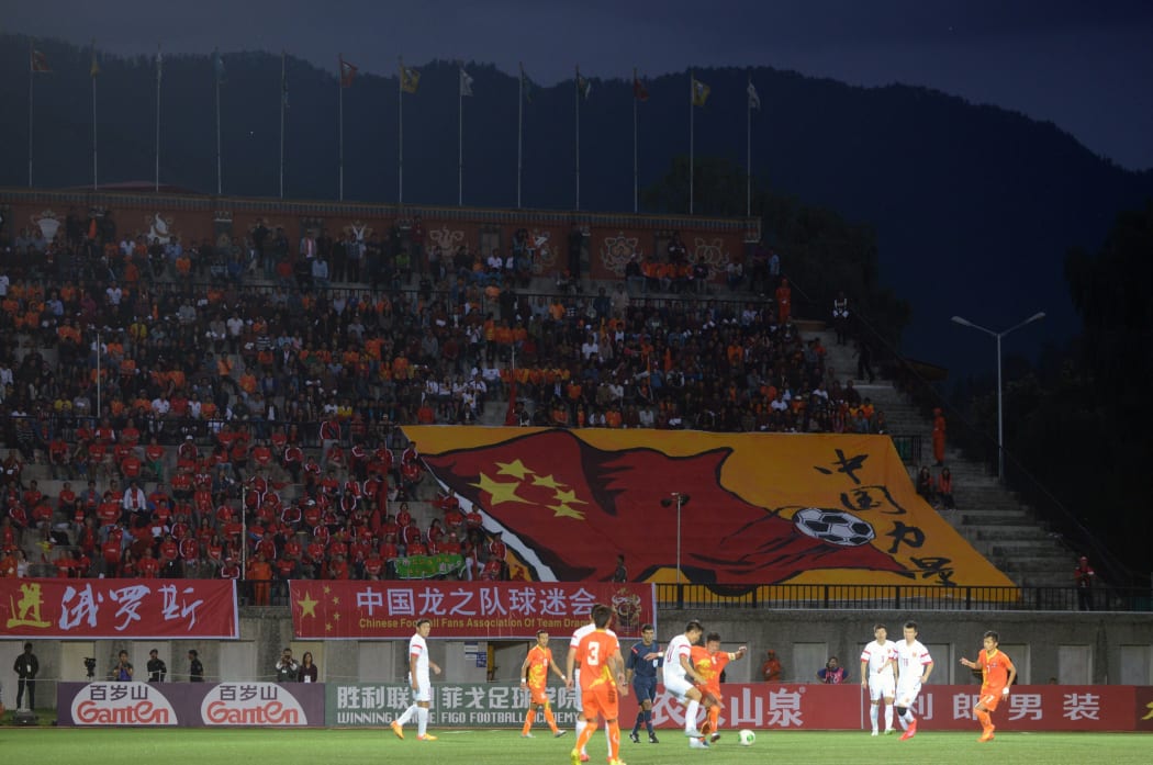 Bhutan and China contest a 2018 FIFA World Cup qualifying match at the Changlimithang Stadium in Thimphu in 2015.