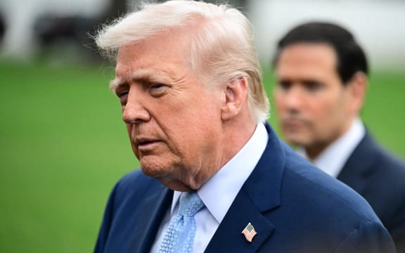 U.S. President Donald J. Trump speaks to reporters about the Strait of Hormuz, Iran, the death of Chuck Norris, and other news of the day while accompanied by United States Secretary of State Marco Rubio prior to departing on the South Lawn of the White House in Washington, D.C., on March 20, 2026.