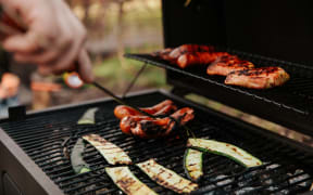 Barbecued courgettes and sausages.