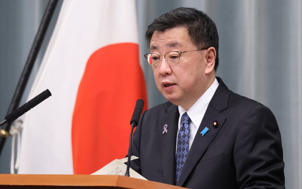 Japanese Chief Cabinet Secretary Hirokazu Matsuno attends a press conference on November 16, 2022.