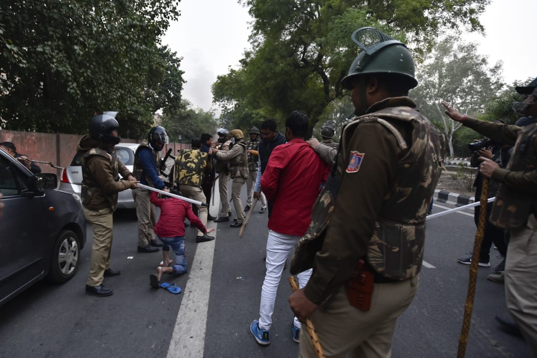 Police clash with demonstrators following a protest against the Indian government's Citizenship Amendment Bill.