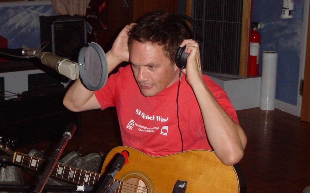 Shayne Carter preparing for a live performance with Dimmer at RNZ's Helen Young Studio