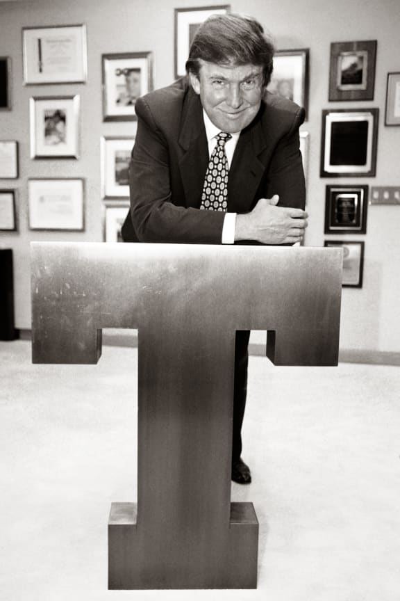 New York real estate giant Donald Trump poses in his Trump Tower office on a giant letter "T" on May 8, 1996.