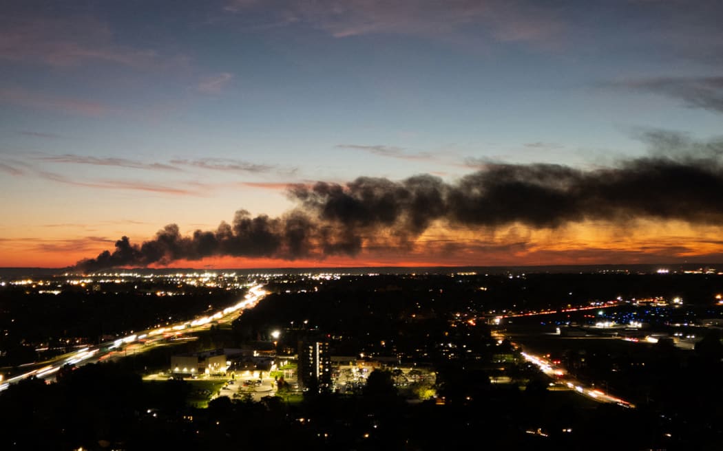 Smoke rises from the site of a UPS cargo plane crash near the UPS Worldport at Louisville Muhammad Ali International Airport in Louisville, Kentucky, on November 4, 2025. A UPS cargo plane crashed on the evening of November 11 near the Louisville International Airport shortly after takeoff, the US Federal Aviation Administration (FAA) said, as local media in the Kentucky city aired video of a large plume of smoke rising above the facility.
"UPS Flight 2976 crashed around 5:15 p.m. local time," the FAA said, identifying the aircraft as a McDonnell Douglas MD-11 headed to Hawaii. (Photo by LEANDRO LOZADA / AFP) / ALTERNATE CROP