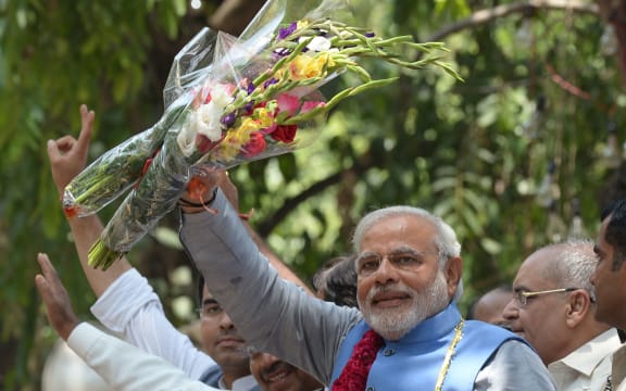 Narendra Modi arriving at party headquarters in New Delhi after his party's crushing poll victory.