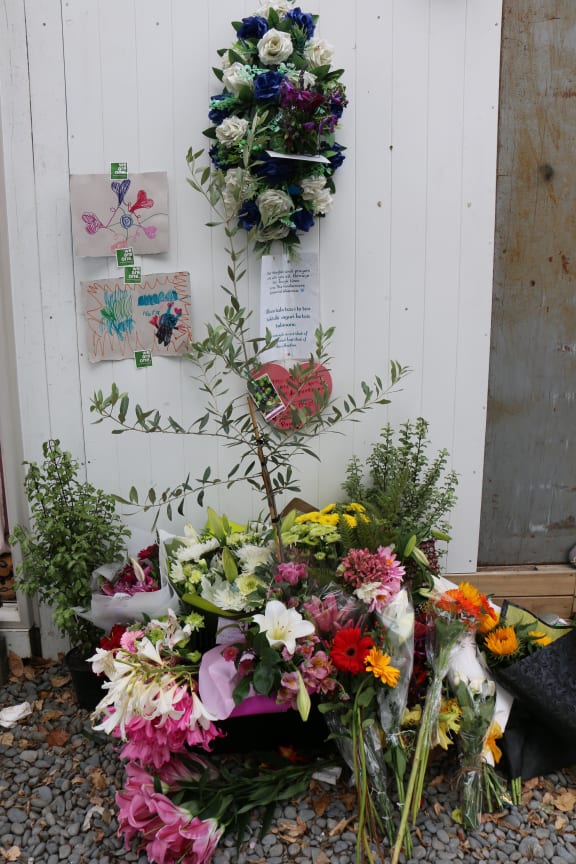 Tributes have been laid at the entrance to Linwood Mosque on the one-year anniversary since the shootings.