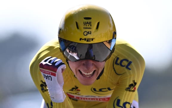 Team UAE Emirates' Tadej Pogacar of Slovenia celebrates after crossing the finish line during the 20th stage of the 108th edition of the Tour de France cycling race.