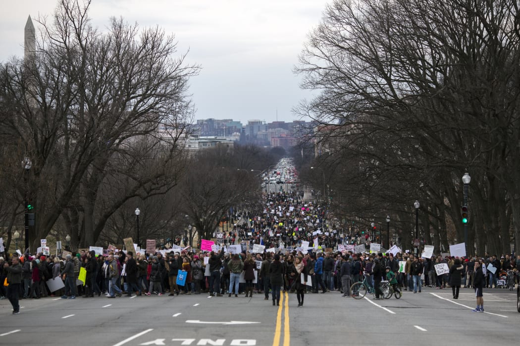Demonstrators march to the Capitol in protest of President Donald Trump's immigration policies on January 29.
