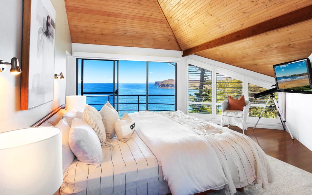 The home features "timber-lined cathedral ceilings" and a "master suite with walk-through ensuite".