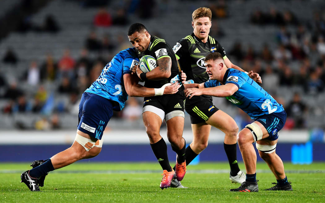 Hurricanes Ngani Laumape charges into the defence.