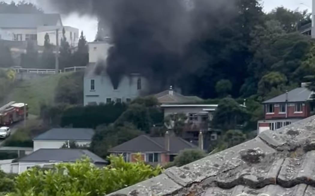 Fire and Emergency has sent out a smoke warning in Dunedin as crews battle a fire in the Roslyn Scout Hall.