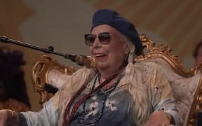 Joni Mitchell performing at the Newport Folk Festival 2022