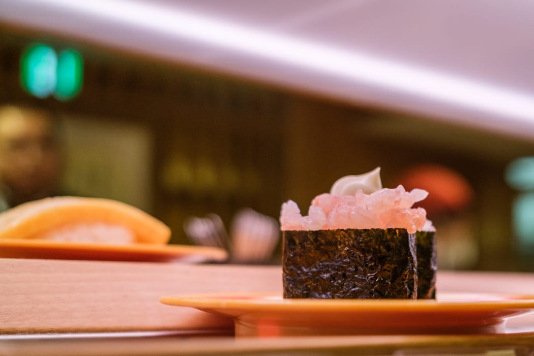 Plates of sushi on a conveyor belt at a sushi chain restaurant in Tokyo on 3 February, 2023.
