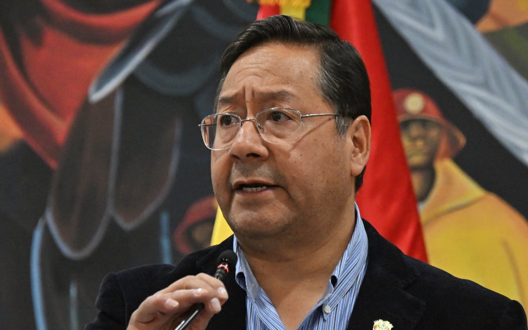 Bolivian President Luis Arce talks to the media during a press conference in La Paz on June 27, 2024. Bolivia's government said on June 27, 2024, that 17 people, including active and retired military personnel and civilians, have been arrested over a failed coup against President Luis Arce. (Photo by AIZAR RALDES / AFP)