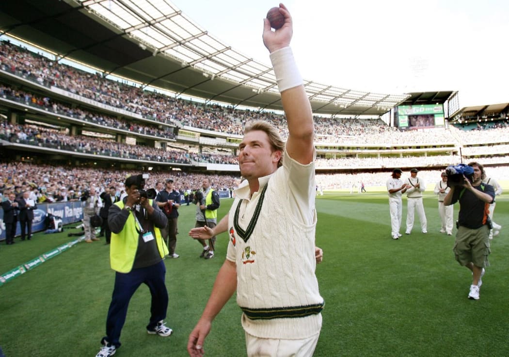 In this file photograph taken on December 28, 2006, Australian spinner Shane Warne waves to the crowd after playing his last Test Match on his home ground, the MCG, on the third day of the fourth cricket Test played in Melbourne.