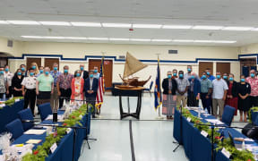 The first in-person negotiating session to renew provisions of a Compact of Free Association between the United States and the Marshall Islands took place at the US Army base at Kwajalein June 14-16. US Ambassador Joseph Yun is in the front of the US negotiation team next to the US flag, while Marshall Islands Foreign Minister Kitlang Kabua stands next to a Marshall Islands flag with her negotiation group.