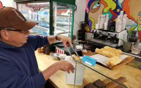 Richard Carter picks up some unsold food from a cafe.