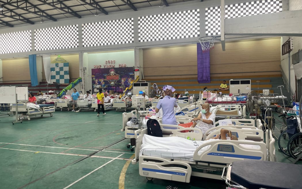 Patients are attended to in a makeshift medical treatment area in the recreational hall of a hospital in Bangkok on 29 March, 2025, a day after an earthquake struck central Myanmar and Thailand.