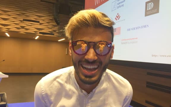 HashtagOurStories founder Yusuf Omar with camera-equipped glasses he uses to capture video in the field.