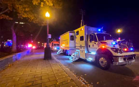 A police truck parked near the National Assembly of Quebec, in Quebec City, early on 1 November, 2020, after two people were killed and five wounded ina sword attack.