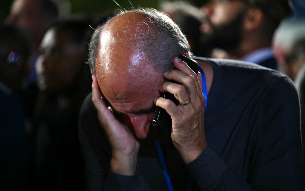 A supporter reacts to election results during an election night event for US Vice President and Democratic presidential candidate Kamala Harris at Howard University in Washington, DC, on November 5, 2024. (Photo by ANGELA WEISS / AFP)