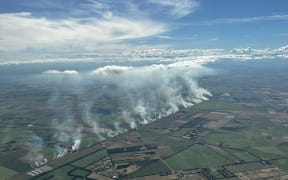 An aerial photo taken about 4.30pm Sunday as fires flared up along a Canterbury rail line.