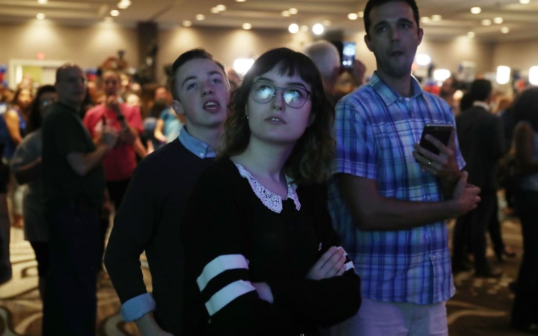 Anxious faces at the election party for Democratic candidate Jon Ossoff, as results come in.