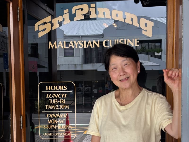 Sri Pinang owner Ange Siew in from of her iconic K-road restaurant