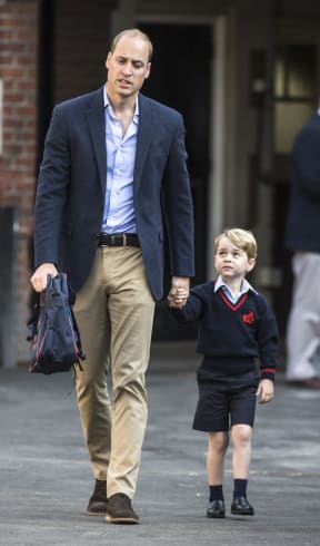 Duke of Cambridge Prince William escorts his son Prince George to the boy's first day of school.