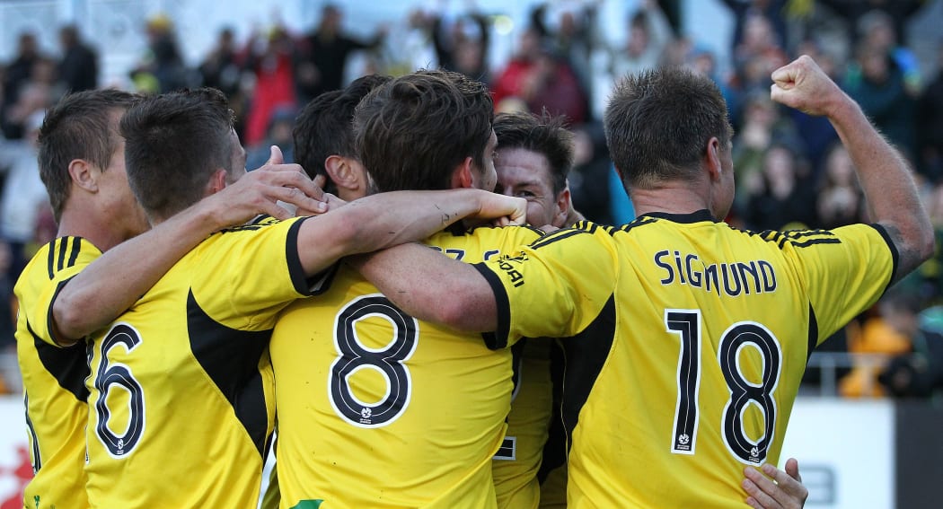Phoenix players celebrate Nathan Burns' goal at the Hutt Rec