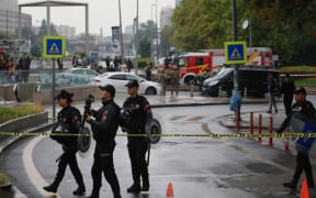 Members of Turkish Police Special Forces secure the area near the Interior Ministry following a bomb attack in Ankara, on 1 October 2023, leaving two police officers injured.