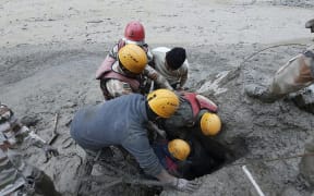 Members of the Indo-Tibetan Border Police during a rescue operation after a broken glacier caused a major river surge that swept away bridges and roads, at Reni village in Chamoli district of Uttarakhand.