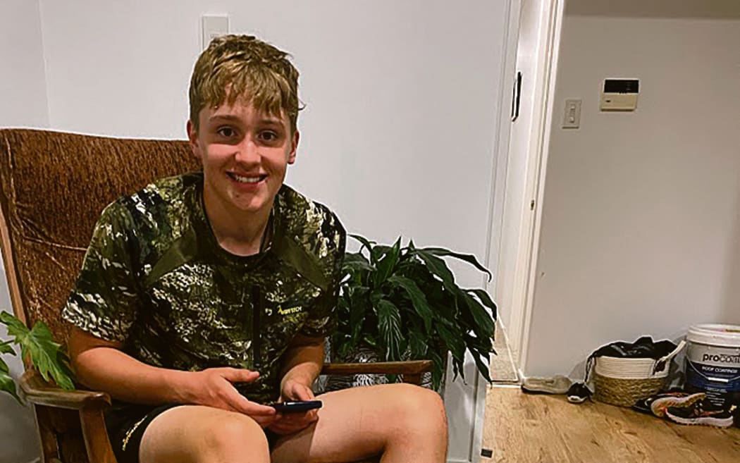 Jack enjoys a foot bath after walking 40 kilometres over 12 hours with blisters.
