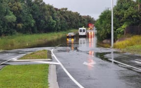 The scene of flooding in Mangawhai where a car got stuck after surface flooding.