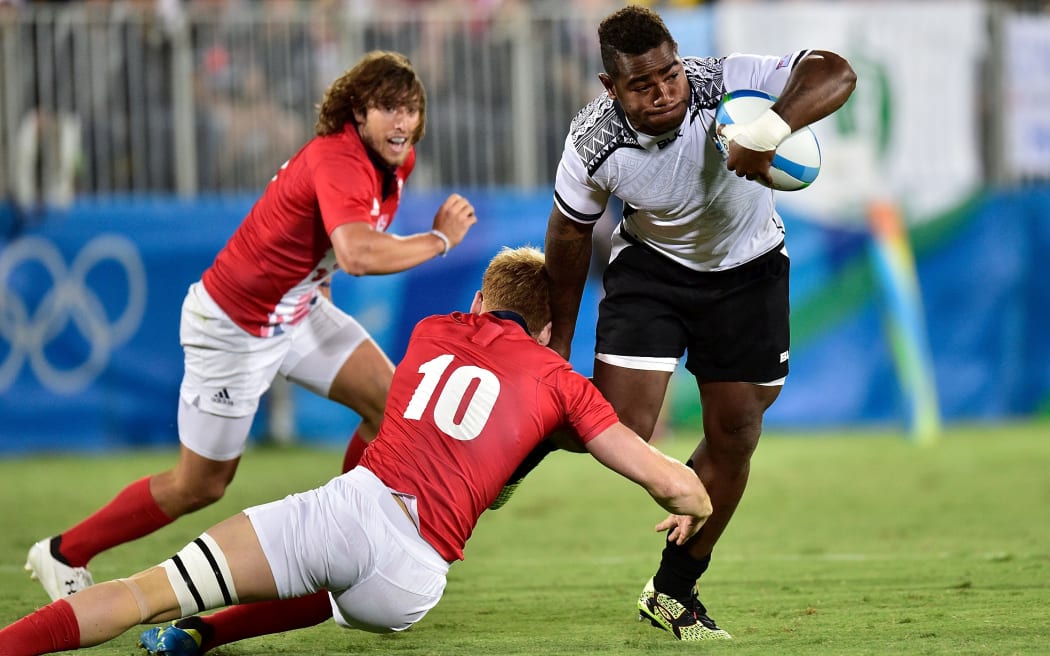 Fiji's Josua Tuisova is tackled during the men's rugby sevens final at the 2016 Rio Olympics.