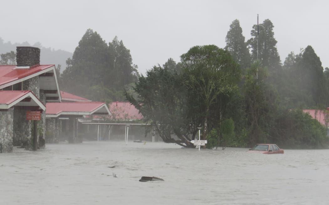 The Scenic Hotel Group's Mueller Wing hotel complex under flood after the Waiho River swept over the nearby stop bank in April 2016, during a 'moderate' flood.