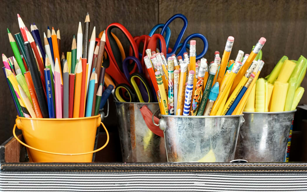 Pens and pencils in a classroom.