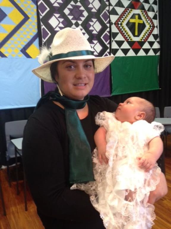 Racquel McKenzie and her baby Te Kopere after his baptism at the 70th Hui Aranga in March 2016.