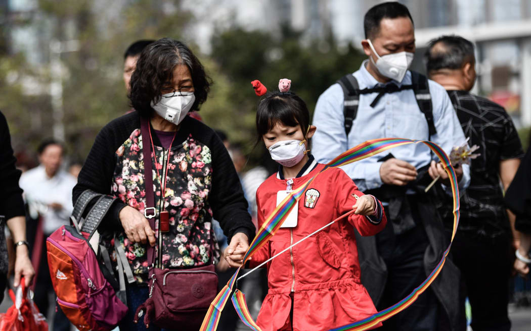 Chinese citizens wear masks in an attempt to protect themselves against the coronavirus.