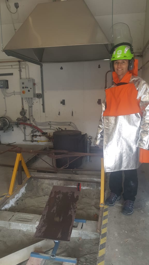 PhD student Dale Cusack wearing a kevlar outfit to protect him from extremely high temepratures in the Lava Lab.