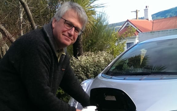 Henrik Moller plugs in his electric vehicle